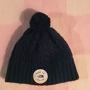 The North Face blue kitted pom pom hat